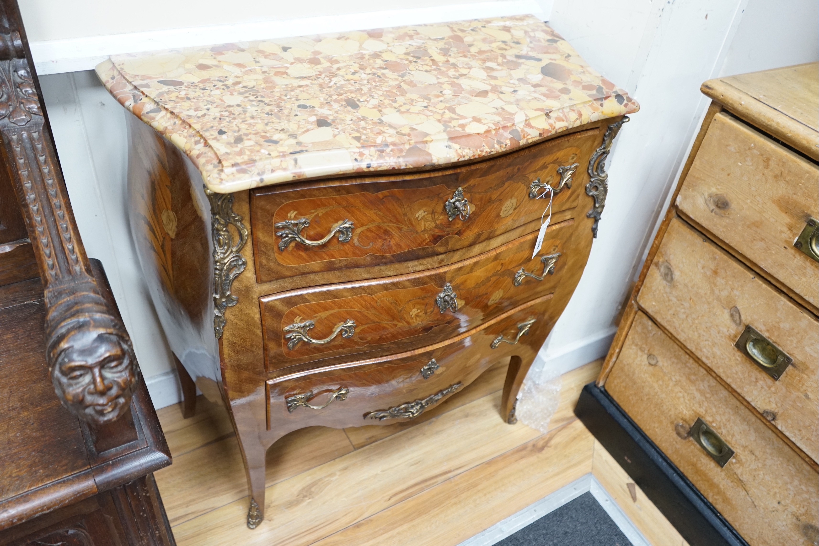 A Louis XV style marquetry inlaid marble topped serpentine three drawer commode, width 83cm, depth 40cm, height 87cm